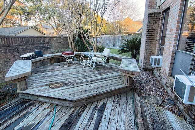 wooden terrace featuring cooling unit