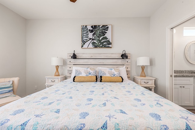 bedroom with ensuite bathroom and ceiling fan