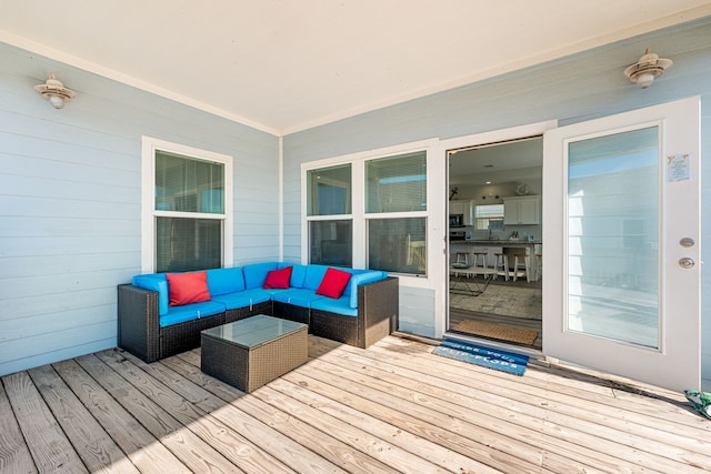 deck featuring an outdoor living space and sink