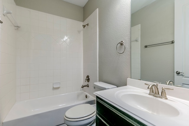 full bathroom with toilet, tiled shower / bath combo, and vanity