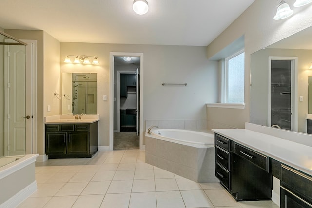 bathroom featuring vanity, separate shower and tub, and tile patterned flooring