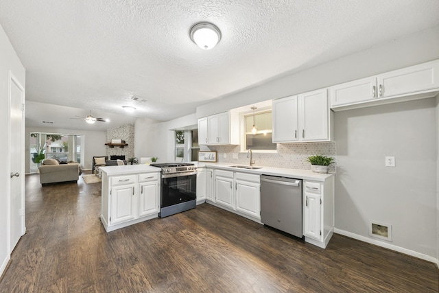 kitchen featuring white cabinets, kitchen peninsula, sink, and stainless steel appliances