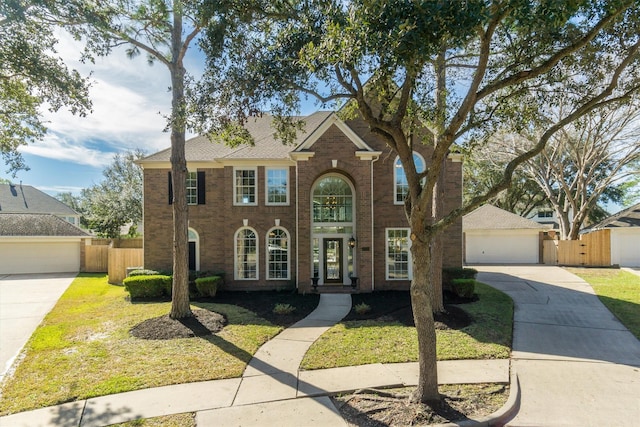 view of front of property with a front lawn and a garage