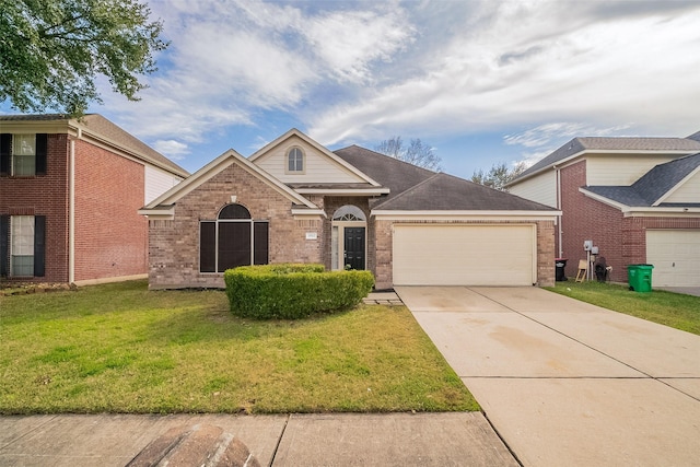 view of front of home with a garage and a front yard