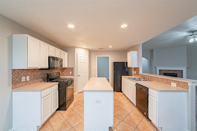 kitchen with white cabinetry, black appliances, kitchen peninsula, and light tile patterned flooring