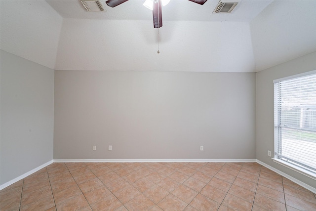 unfurnished room featuring lofted ceiling, light tile patterned floors, and ceiling fan