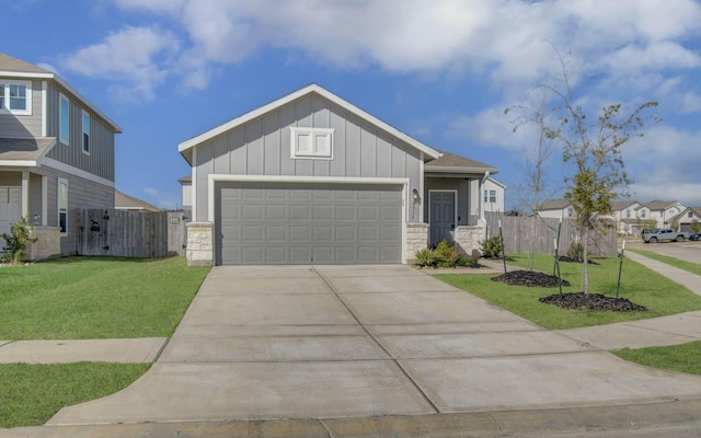 view of front of property with a front yard and a garage