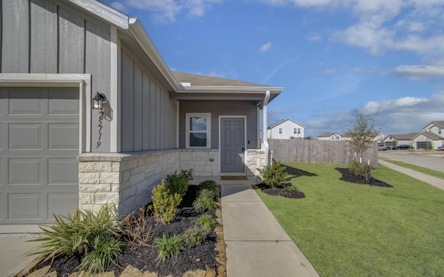 property entrance featuring a yard