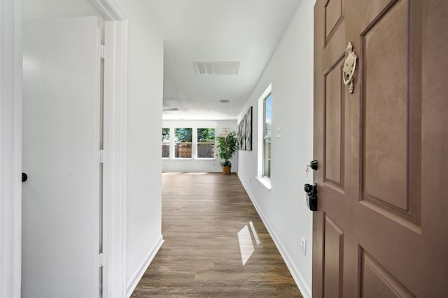 corridor featuring wood-type flooring