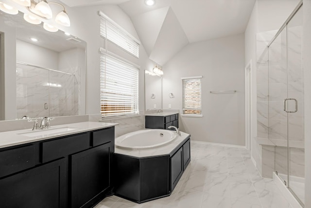 full bath with a sink, marble finish floor, vaulted ceiling, a shower stall, and two vanities