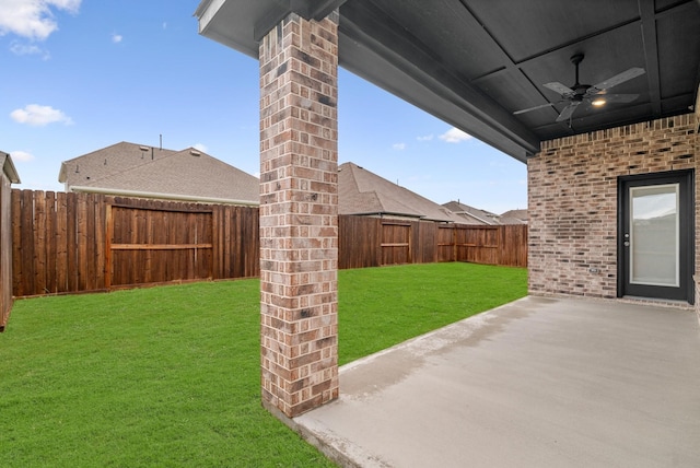 view of yard featuring ceiling fan, a patio area, and a fenced backyard