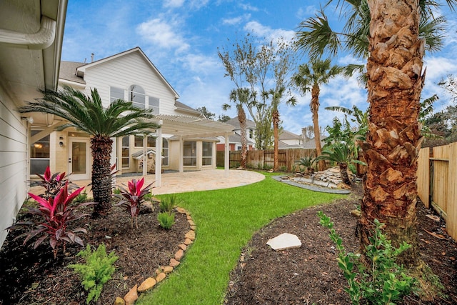 view of yard with a pergola and a patio