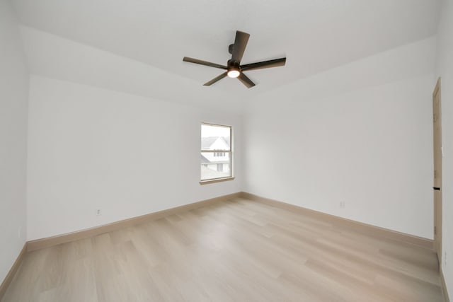 empty room featuring ceiling fan and light wood-type flooring