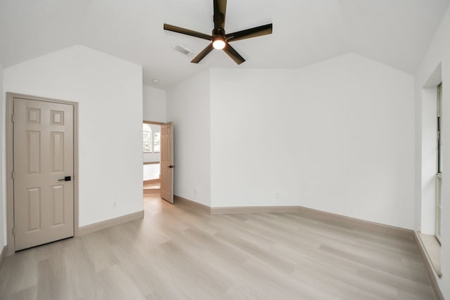 unfurnished room with light wood-type flooring, ceiling fan, and lofted ceiling