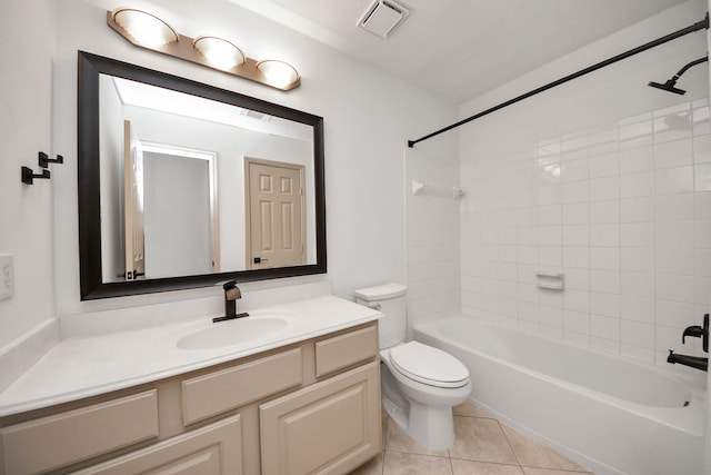 full bathroom with toilet, vanity, tile patterned floors, and tiled shower / bath