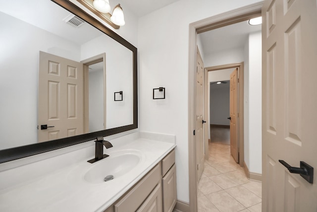 bathroom with tile patterned flooring and vanity