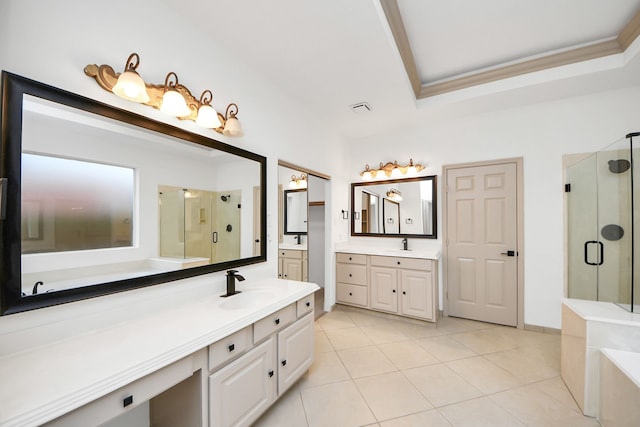 bathroom featuring an enclosed shower, tile patterned flooring, vanity, ornamental molding, and a tray ceiling