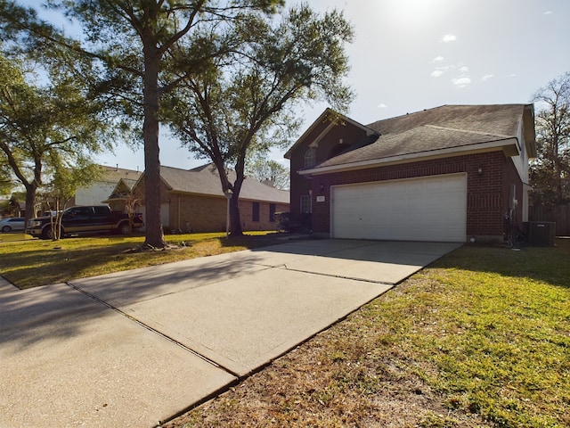 view of home's exterior featuring a garage, a lawn, and central air condition unit