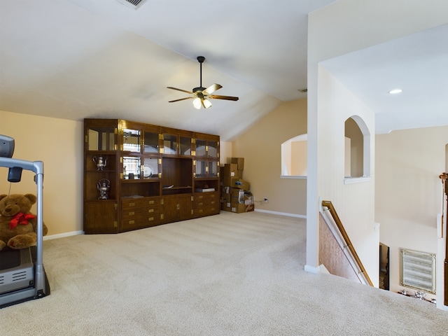 interior space featuring ceiling fan and vaulted ceiling