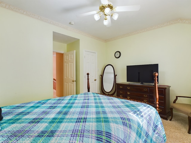 bedroom with ceiling fan and light colored carpet