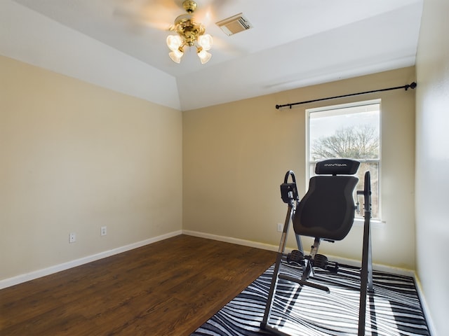 workout room with ceiling fan, dark wood-type flooring, and lofted ceiling