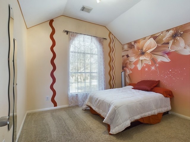 bedroom with carpet and vaulted ceiling