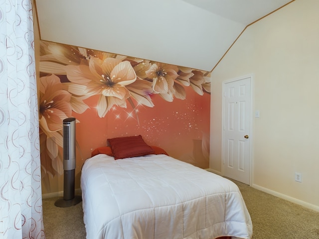 carpeted bedroom with lofted ceiling