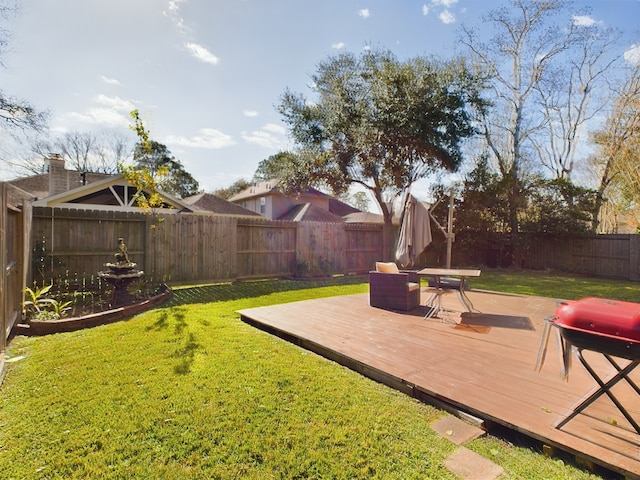 view of yard featuring a wooden deck