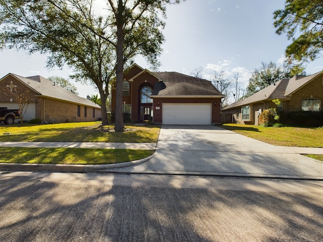 ranch-style home with a garage and a front lawn