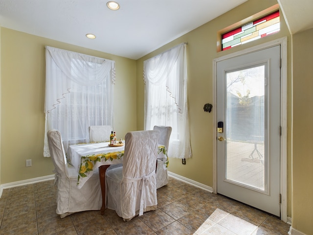 dining area featuring tile patterned flooring