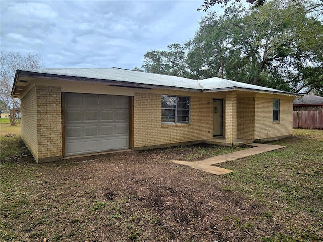 ranch-style home with a garage, driveway, fence, and brick siding