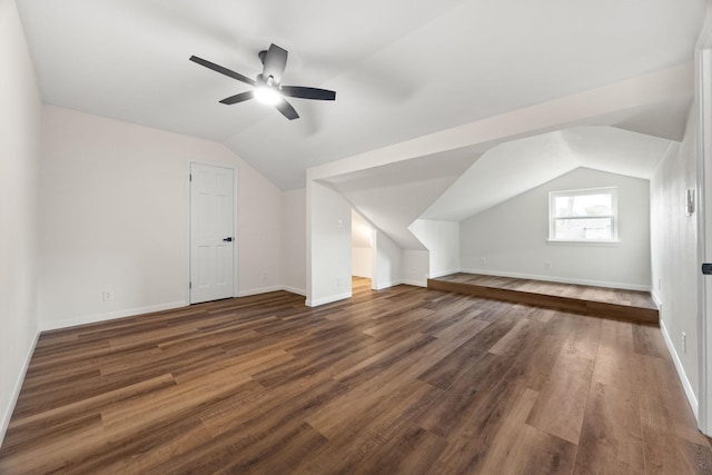 bonus room featuring vaulted ceiling, ceiling fan, and dark hardwood / wood-style flooring