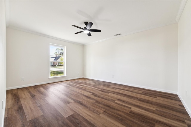 spare room featuring dark wood-type flooring, crown molding, and ceiling fan