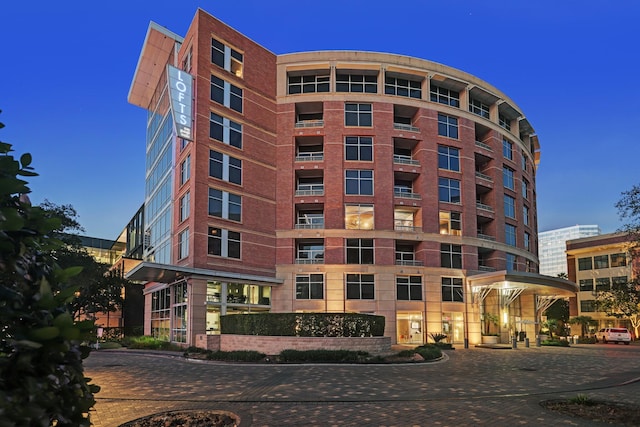 view of outdoor building at dusk