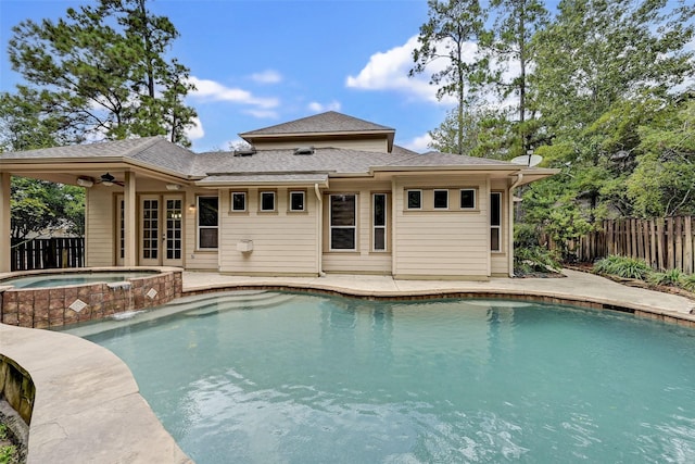 view of pool with ceiling fan, a patio area, and an in ground hot tub