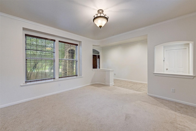 carpeted spare room with ornamental molding