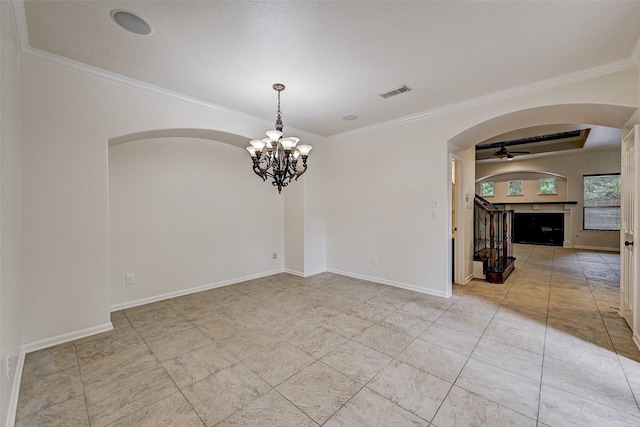 unfurnished room with ceiling fan with notable chandelier and crown molding