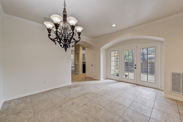 unfurnished dining area with french doors, ornamental molding, and a chandelier