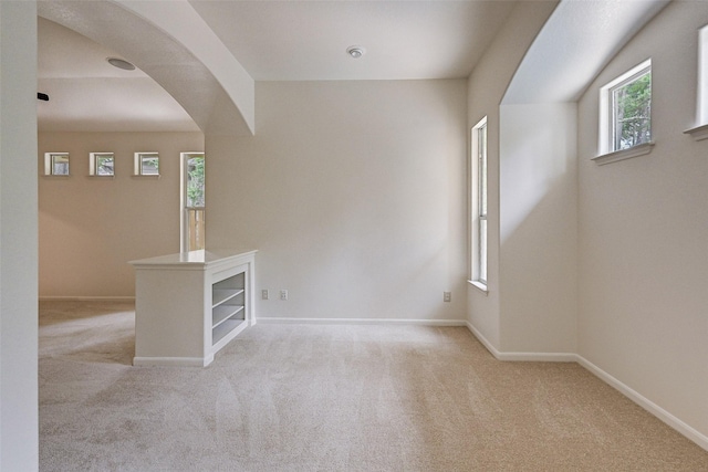 empty room featuring light colored carpet