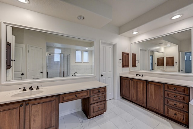 bathroom featuring vanity, tile patterned flooring, and a shower with door