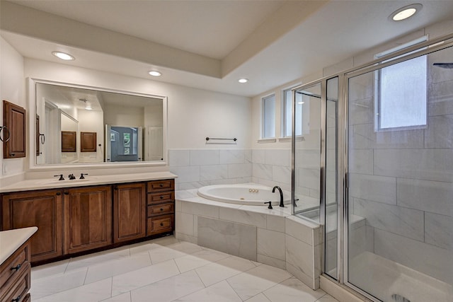 bathroom featuring vanity, tile patterned flooring, a wealth of natural light, and plus walk in shower