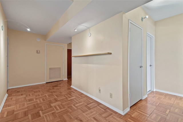 corridor featuring light parquet floors