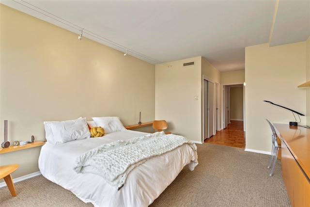 bedroom with carpet floors and a closet