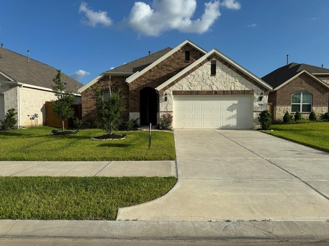 view of front of house featuring a front lawn and a garage