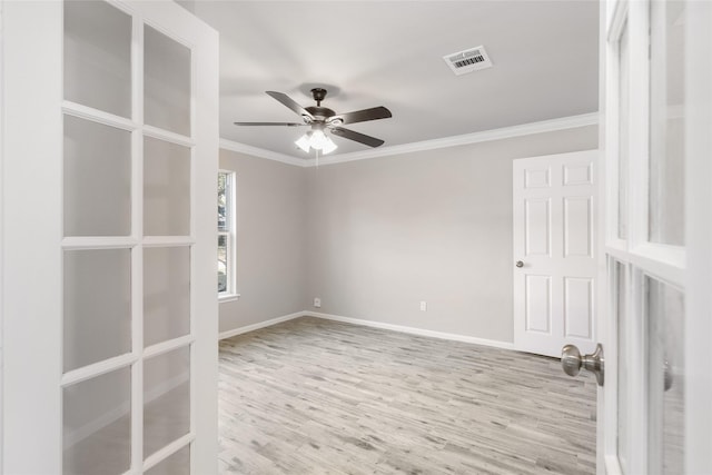 unfurnished room featuring ceiling fan, ornamental molding, and light hardwood / wood-style flooring