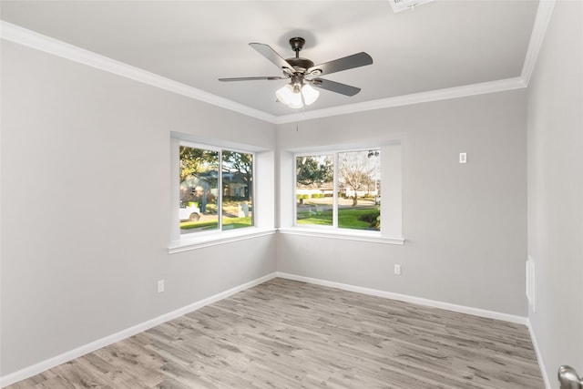 spare room featuring ceiling fan, light hardwood / wood-style flooring, and ornamental molding