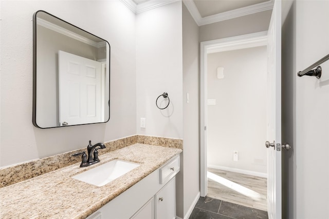 bathroom featuring vanity, ornamental molding, and tile patterned flooring