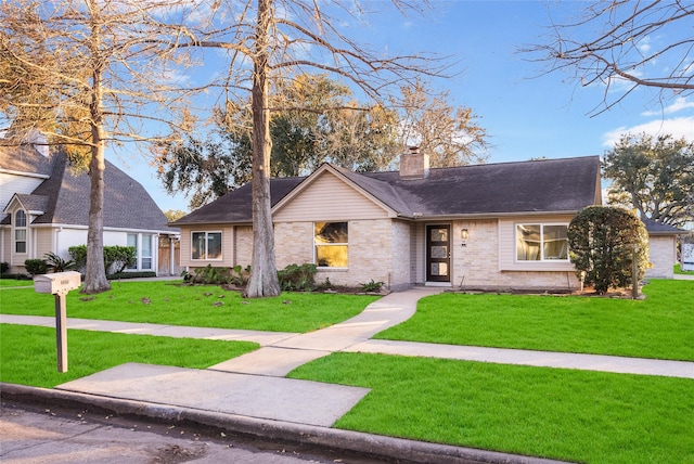 view of front of property with a front lawn