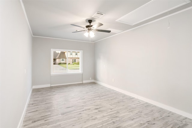 unfurnished room featuring ceiling fan, light wood-type flooring, and ornamental molding