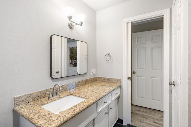 bathroom featuring vanity and wood-type flooring